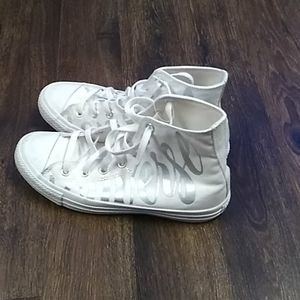 Converses white, with silver logo.